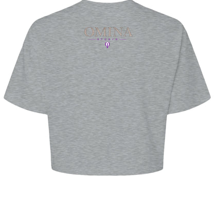 Omina Studio grey cropped heavyweight tee with minimalist front logo and "MOVE WITH INTENTION." typography on back.
