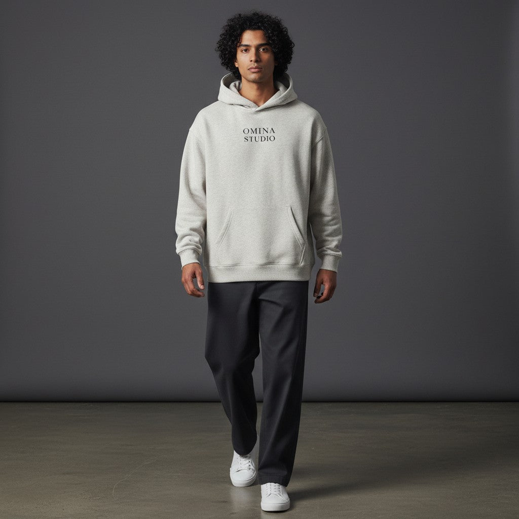 OMINA Studio light grey heavyweight cotton blend hoodie with front pocket and minimalist logo.