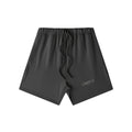 Omina Studio charcoal grey heavyweight French terry shorts with elastic waist, drawstring, and side pockets. Oversized fit.