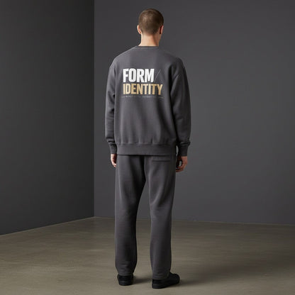 OMINA Studio heavyweight cotton sweatshirt in charcoal grey with oversized fit and graphic print on back.