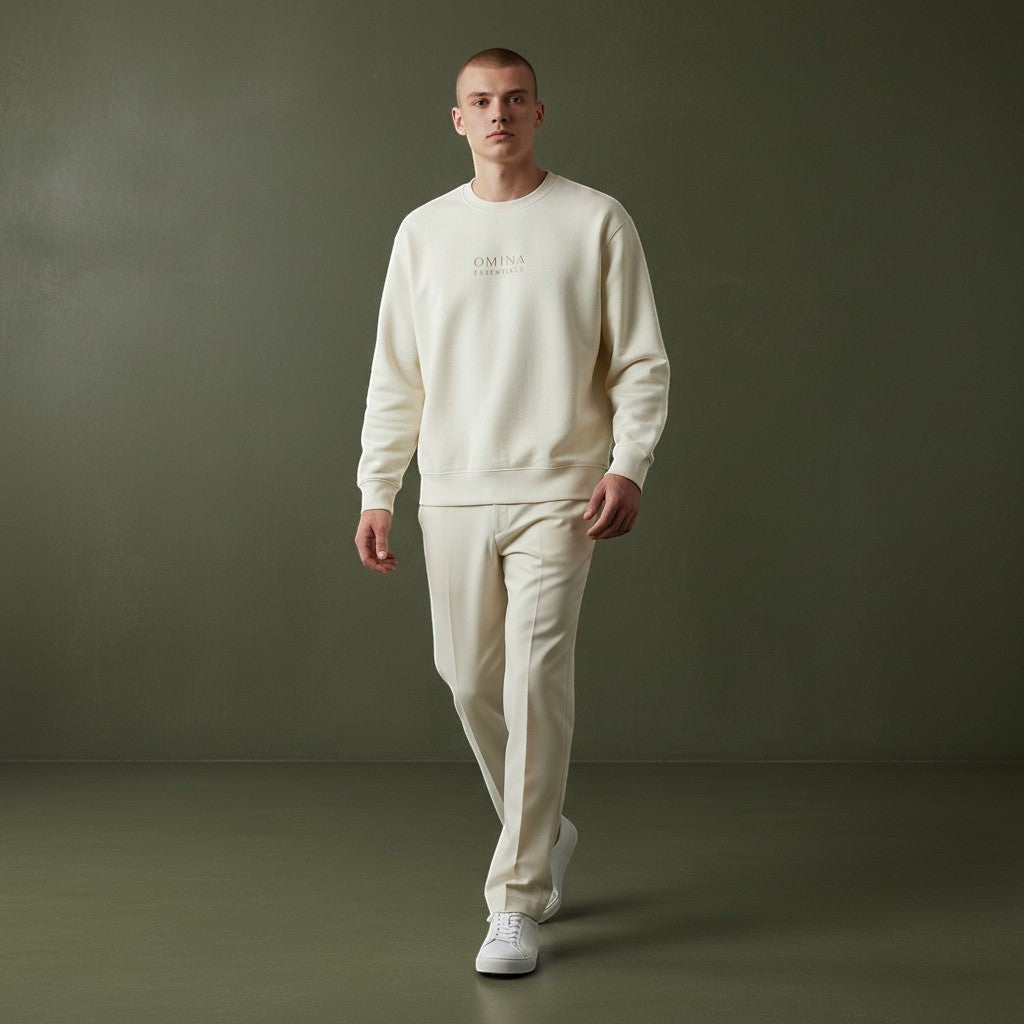 OMINA Studio cream heavyweight cotton sweatshirt with oversized fit and subtle logo detail, worn by a male model.