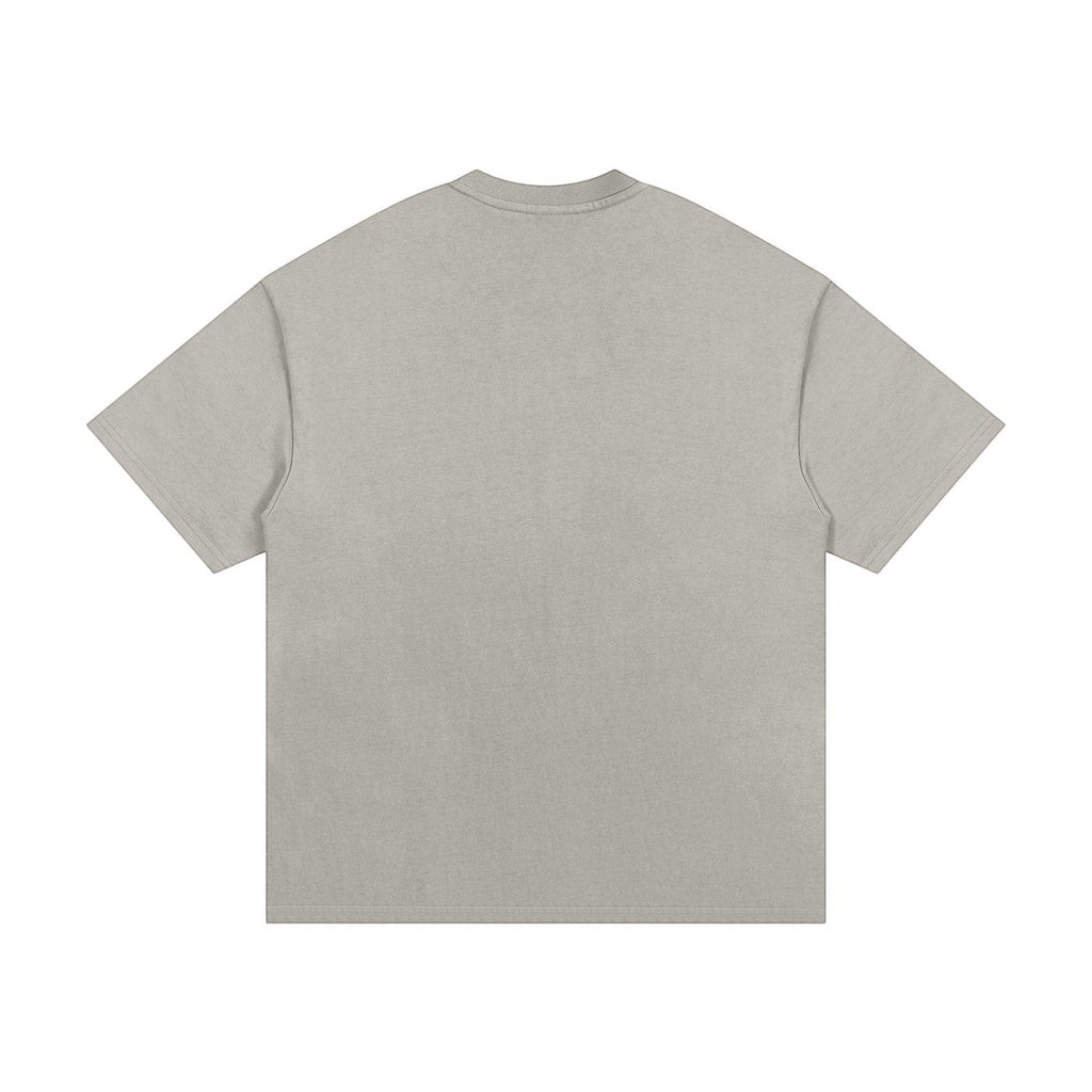 OMINA Studio heavyweight cotton t-shirt in light grey with an oversized relaxed fit and drop shoulders.