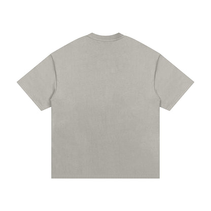 OMINA Studio heavyweight cotton t-shirt in light grey with an oversized relaxed fit and drop shoulders.