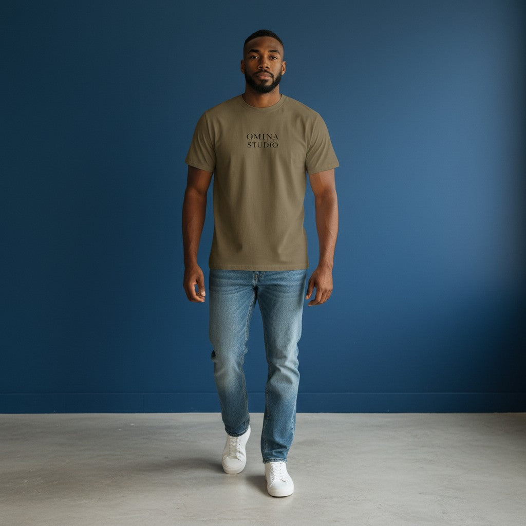 Omina Studio heavyweight cotton t-shirt in olive green with drop shoulders and subtle logo detail.