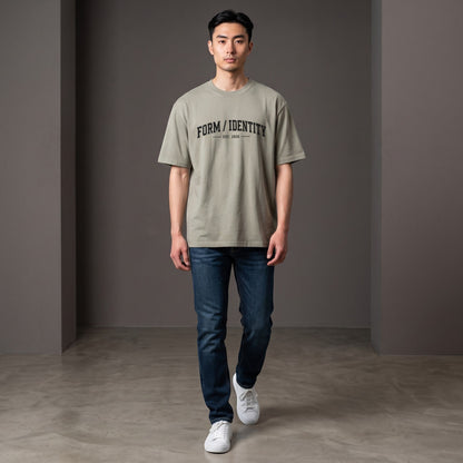 Omina Studio heavyweight cotton t-shirt in taupe with 'FORM / IDENTITY EST. 2026' graphic on front.