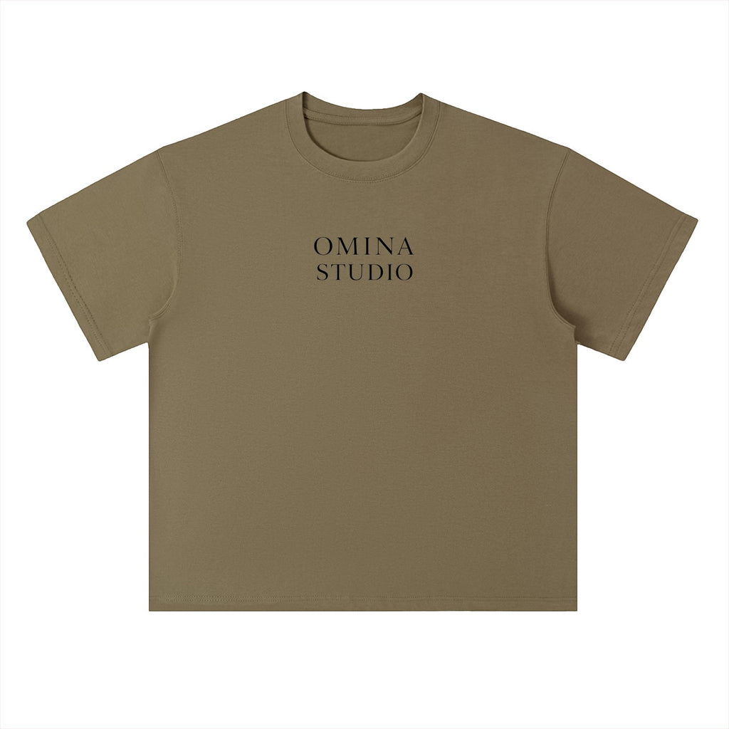 Omina Studio heavyweight cotton t-shirt in olive green with drop shoulders and a relaxed fit. Features a subtle logo.