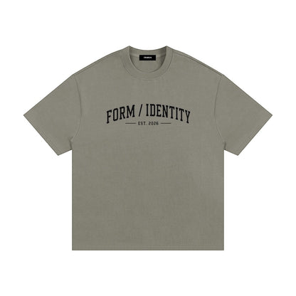 OMINA Studio heavyweight cotton t-shirt in olive green with "FORM / IDENTITY EST. 2026" graphic on chest.