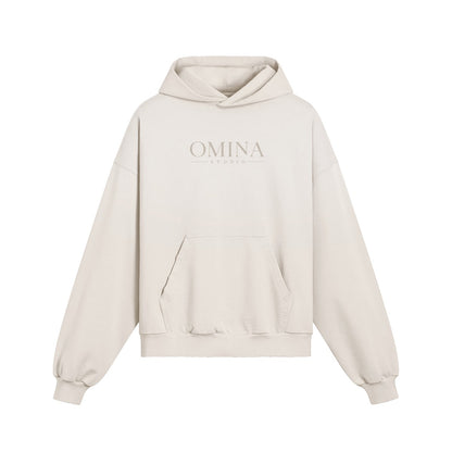 Omina Studio heavyweight cream cotton hoodie with kangaroo pocket and minimalist front logo. Boxy fit.