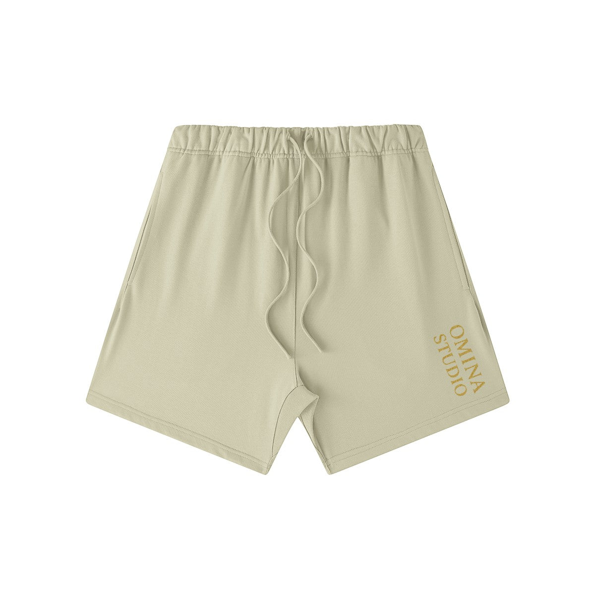 Omina Studio heavyweight beige French terry cotton shorts with drawstring and side pockets.