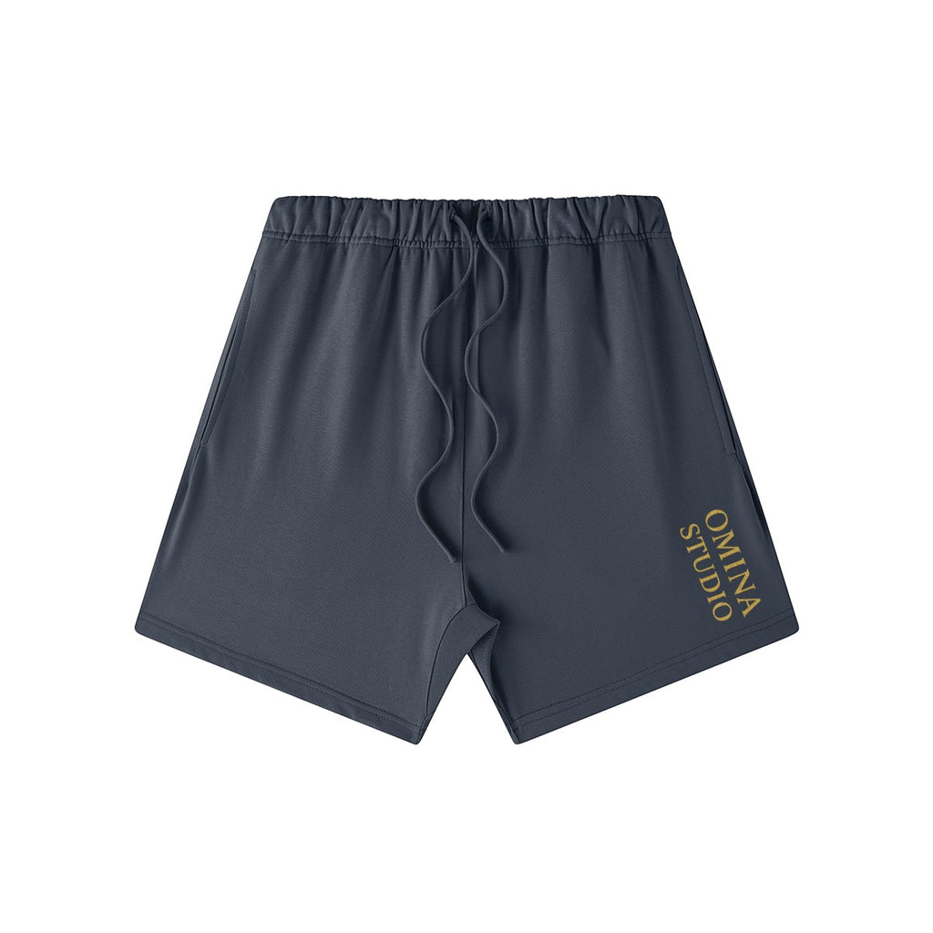 Omina Studio heavyweight dark grey French terry cotton shorts with drawstring and side pockets.