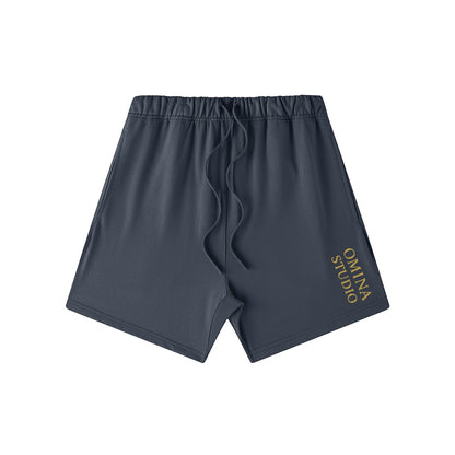 Omina Studio heavyweight dark grey French terry cotton shorts with drawstring and side pockets.