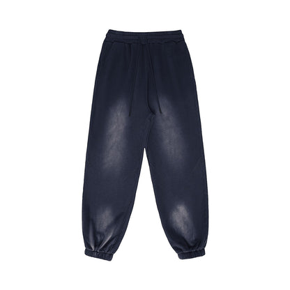 Omina Studio dark wash heavyweight fleece sweatpants with a vintage-inspired finish and relaxed fit.