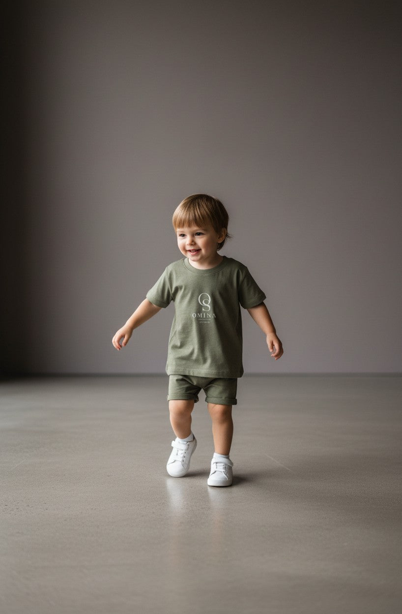 Omina Studio olive green infant t-shirt made from soft, breathable cotton with a classic fit and minimalist logo.
