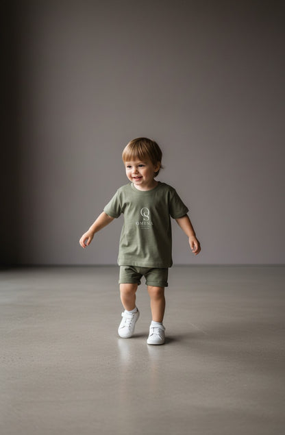 Omina Studio olive green infant t-shirt made from soft, breathable cotton with a classic fit and minimalist logo.