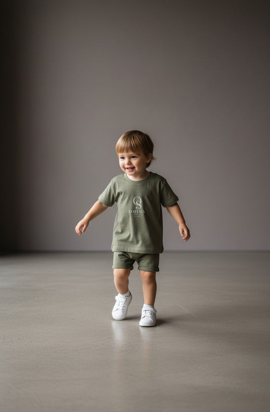 Omina Studio olive green infant t-shirt made from soft, breathable cotton with a classic fit and minimalist logo.