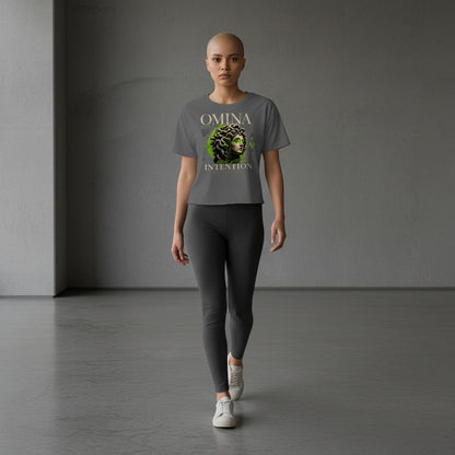Omina Studio grey cropped t-shirt with Medusa bust graphic and "Move With Intention" text.