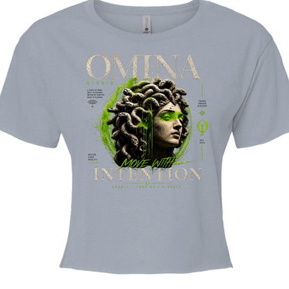 Omina Studio light blue cropped t-shirt with a Medusa bust graphic and gold text "Move With Intention".