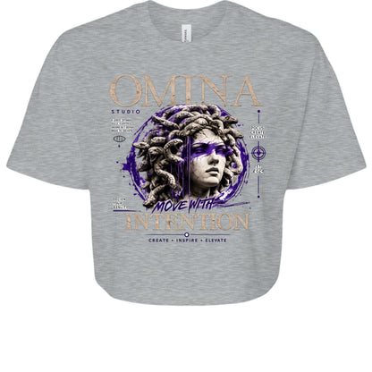 Omina Studio grey cropped heavyweight tee with Medusa graphic and "Move With Intention" text.