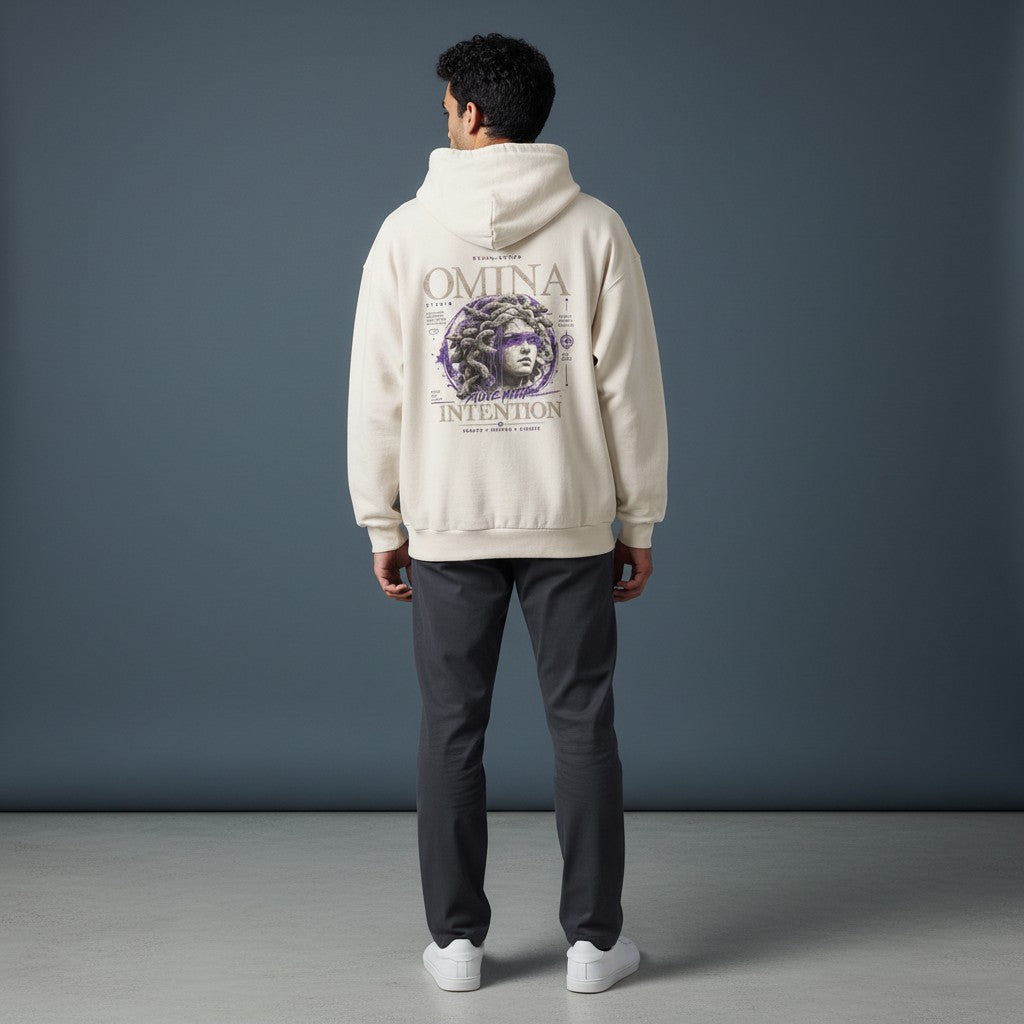 OMINA Studio heavyweight cream cotton hoodie with a graphic of Medusa and the text "Move With Intention" on the back.