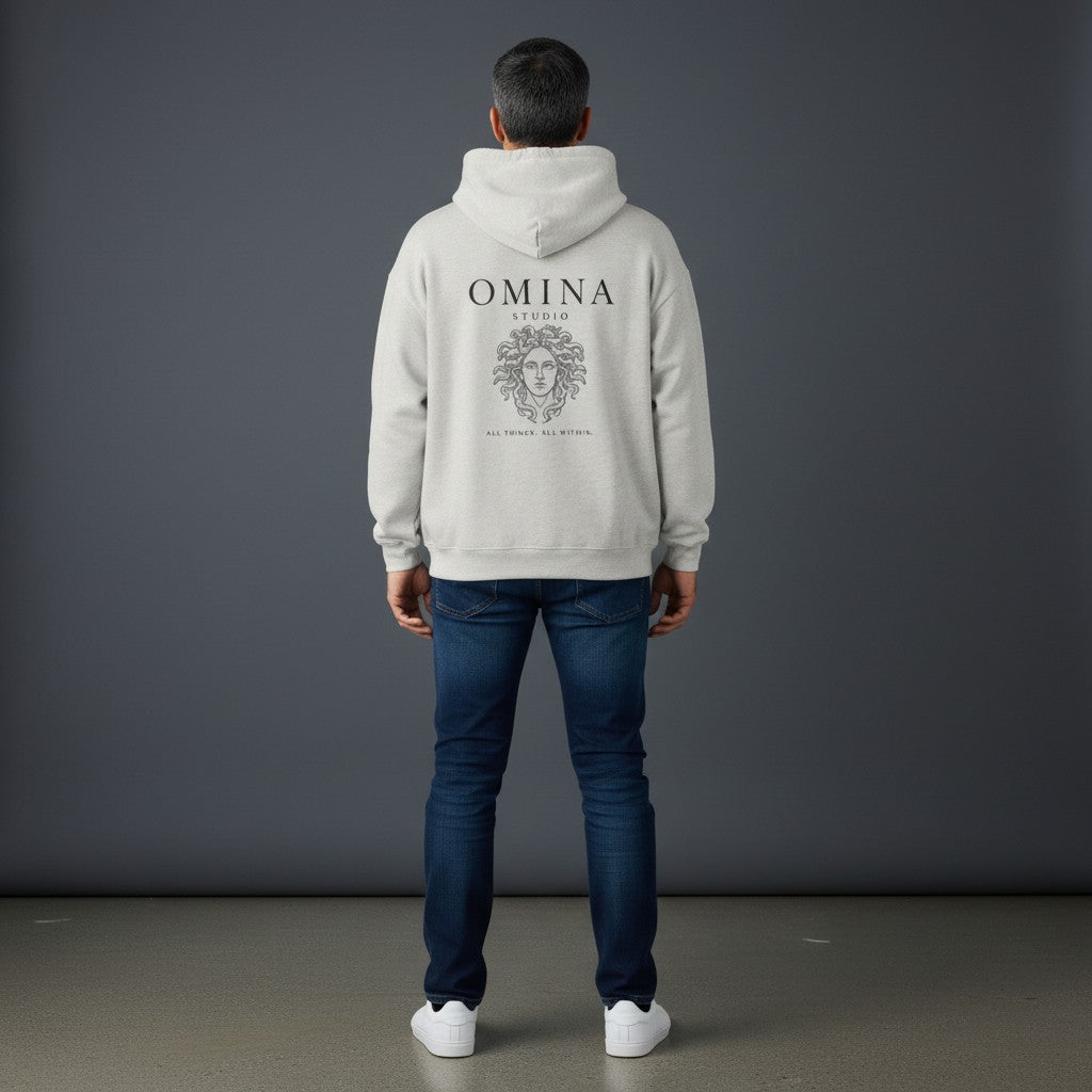 Omina Studio light grey heavyweight cotton hoodie with Medusa graphic and "All Things, All Within" text.