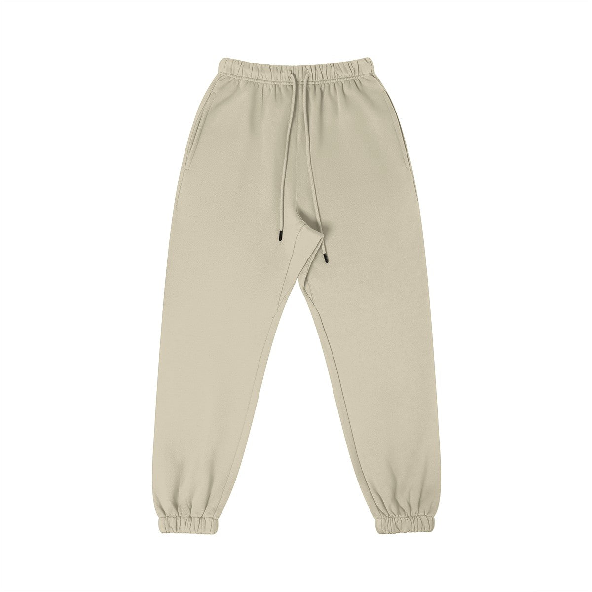 Omina Studio beige 100% combed cotton sweatpants with tapered fit, elastic waistband, drawstring, and cuffed ankles.