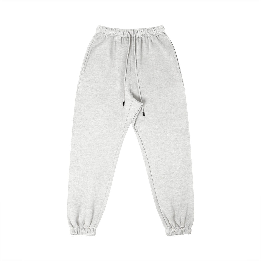 Omina Studio light grey 100% combed cotton sweatpants with tapered fit, elastic waistband, drawstring, and cuffed ankles.