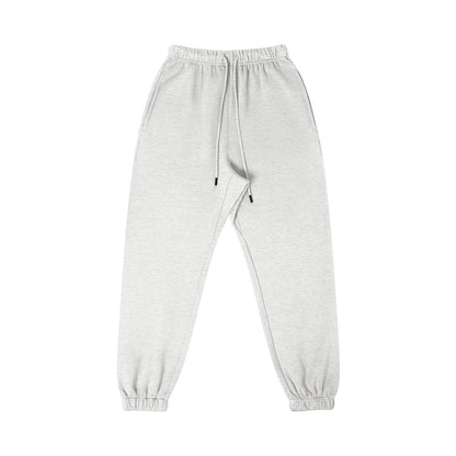 Omina Studio light grey 100% combed cotton sweatpants with tapered fit, elastic waistband, drawstring, and cuffed ankles.