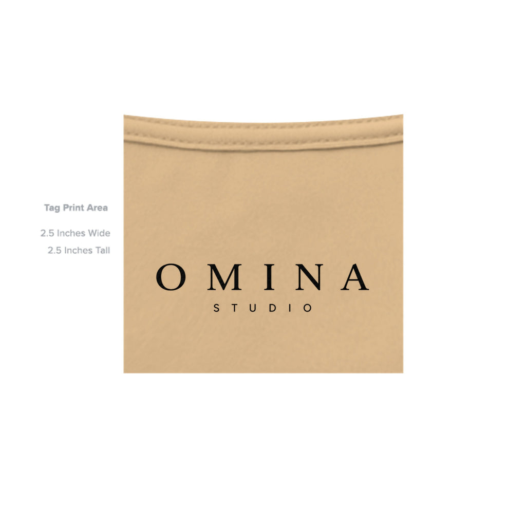 OMINA Studio heavyweight cotton t-shirt in a light tan color with a vintage-inspired finish and signature graphic.