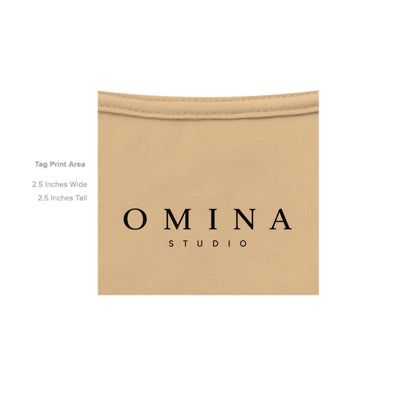 OMINA Studio heavyweight cotton t-shirt in a light tan color with a vintage-inspired finish and signature graphic.