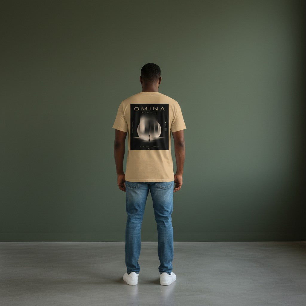 Omina Studio tan heavyweight cotton t-shirt with a graphic print of a person standing before a large moon and abstract shapes.