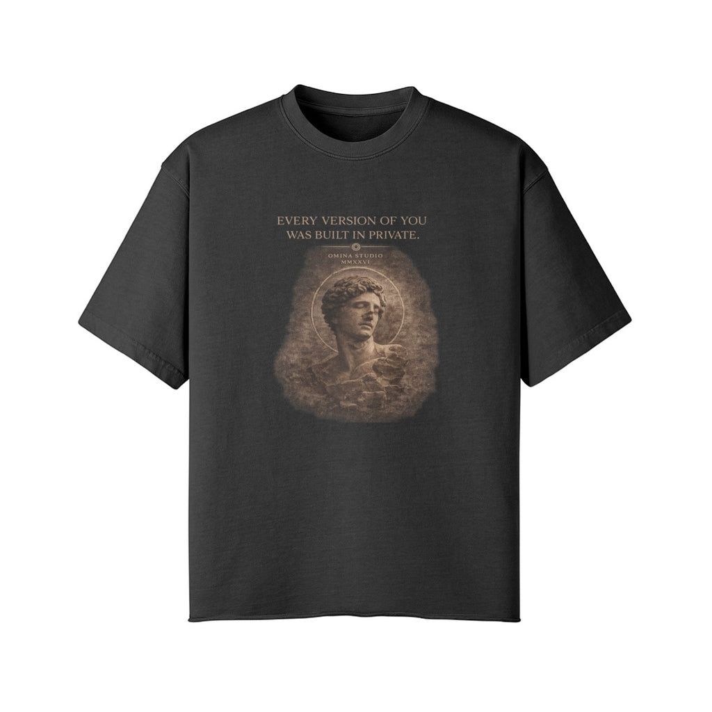 Omina Studio charcoal grey 100% combed cotton oversized t-shirt with raw hem and graphic print of a classical bust.