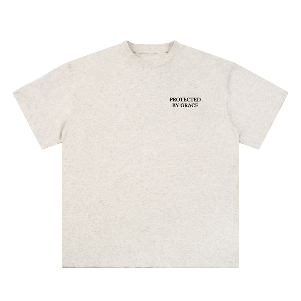 OMINA Studio light grey heathered cotton t-shirt with "PROTECTED BY GRACE" text on the left chest.