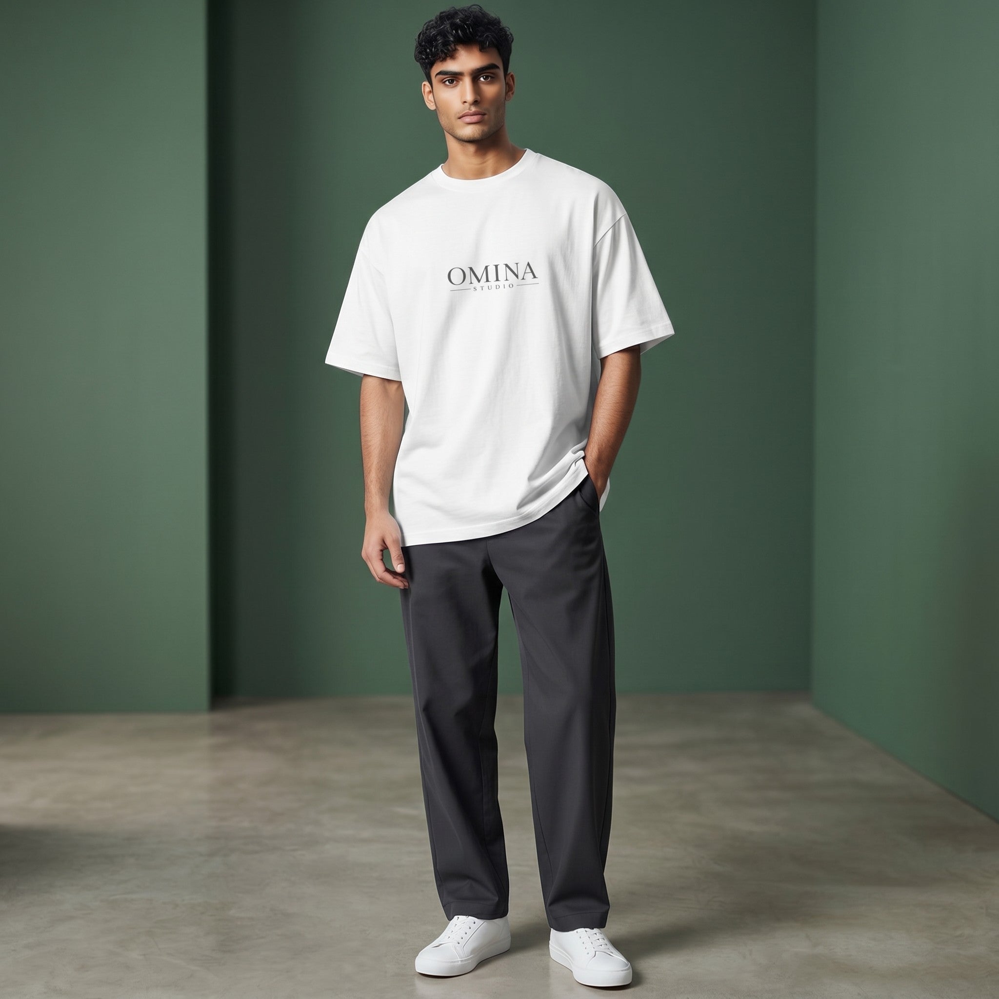 Omina Studio white 100% cotton oversized fit crew neck t-shirt with drop shoulders and minimalist logo.