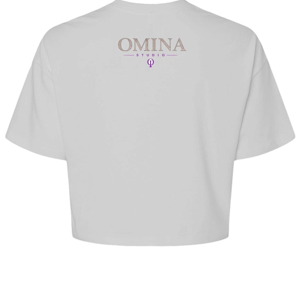 Omina Studio white cropped heavyweight tee with "OMINA STUDIO" logo and purple symbol on back.