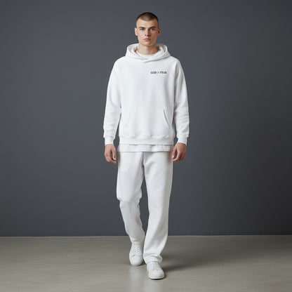 Omina Studio white pullover hoodie with "GOD > FEAR" graphic, kangaroo pocket, and raglan sleeves.
