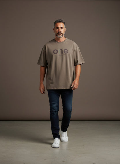 Omina men's oversized short sleeve t-shirt in taupe with a large 'one' graphic and text detail. Made of cotton and spandex.
