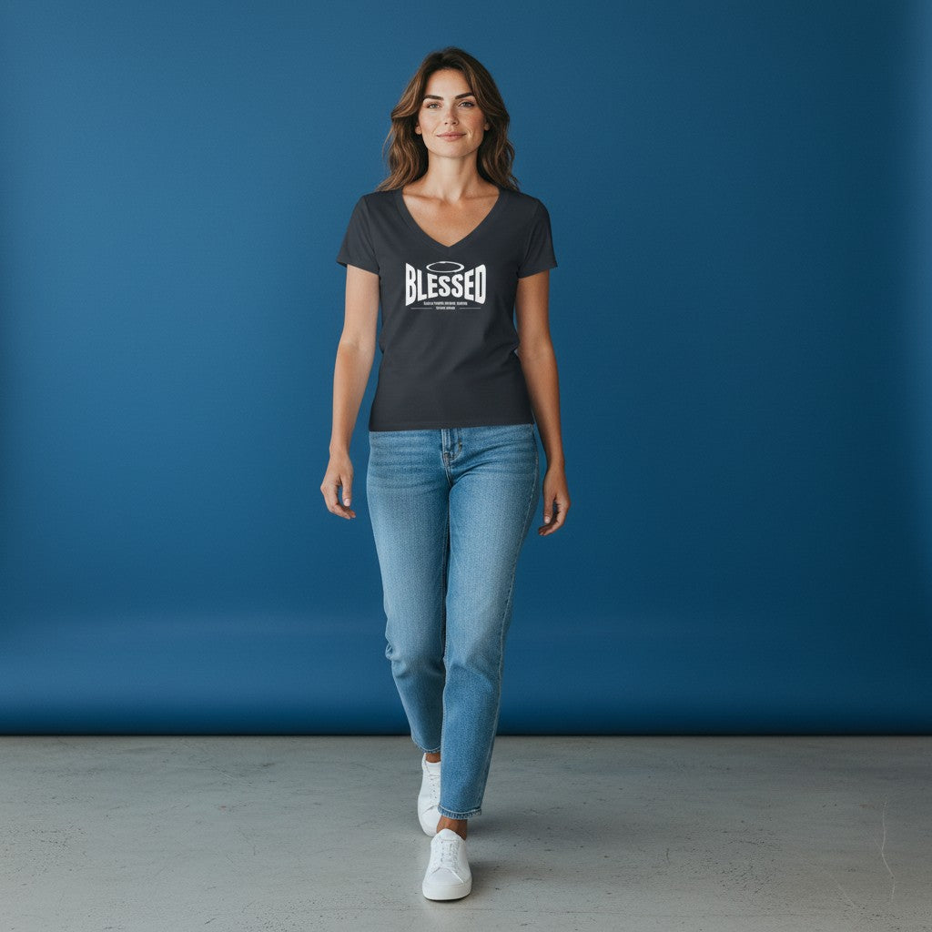 A woman wearing a charcoal Omina Tencel slim fit V-neck T-shirt with a white Blessed graphic, paired with blue jeans.