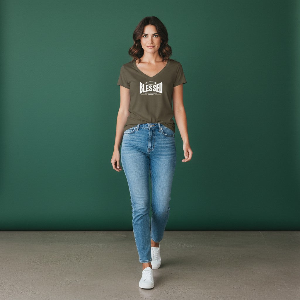 Woman wearing an Omina olive green Tencel slim fit V-neck T-shirt with Blessed graphic, paired with blue jeans.