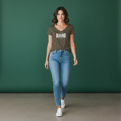 Woman wearing an Omina olive green Tencel slim fit V-neck T-shirt with Blessed graphic, paired with blue jeans.