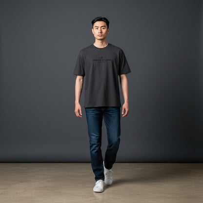 Omina dark grey cotton blend short sleeve t-shirt with Omina Studio logo print on chest. Unisex regular fit.