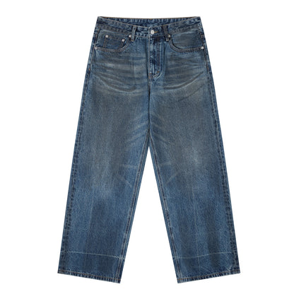 OMINA Essentials vintage wash baggy denim jeans with a relaxed fit and wide-leg silhouette in blue.
