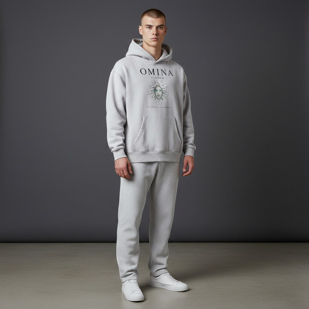 Omina Studio light grey vintage wash oversized hoodie with fleece interior and graphic print of a woman's face.