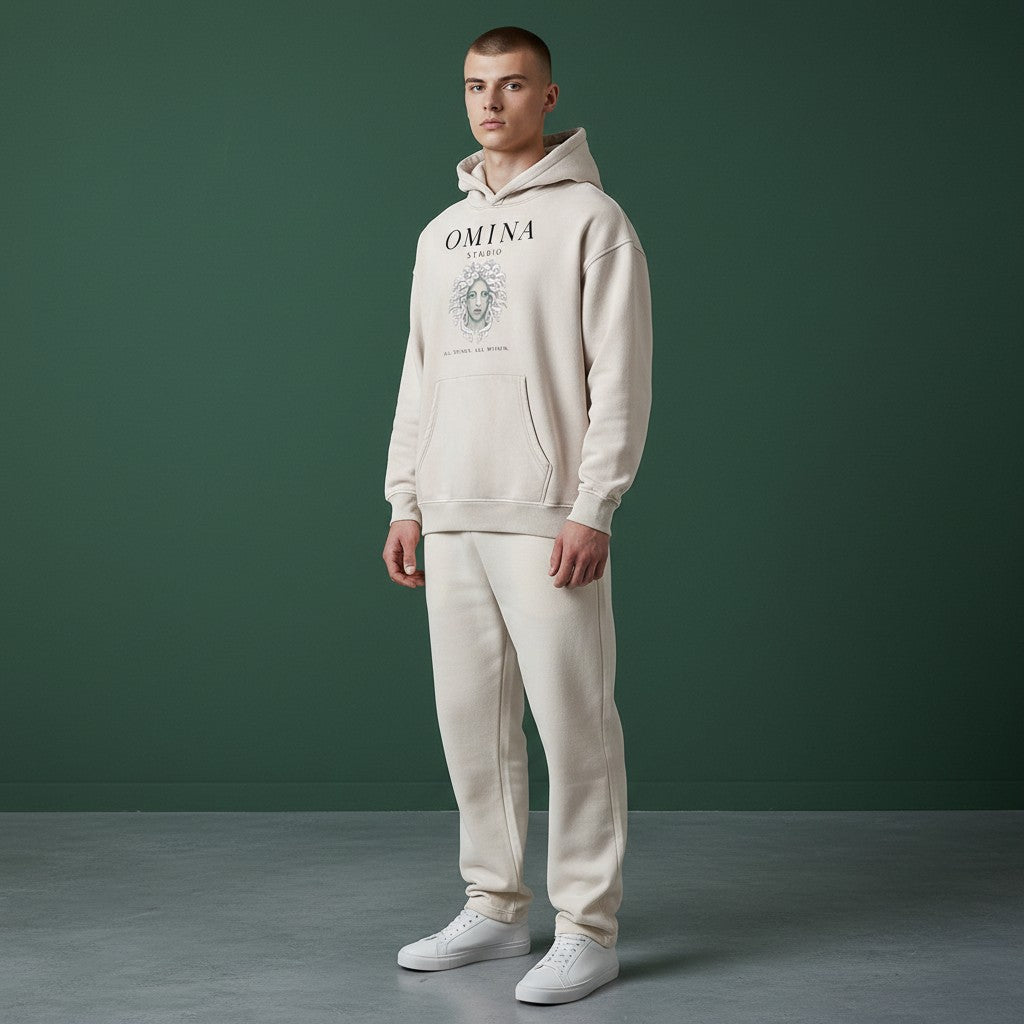 Omina Studio vintage wash oversized hoodie in light beige with fleece interior and graphic print of Medusa's head.