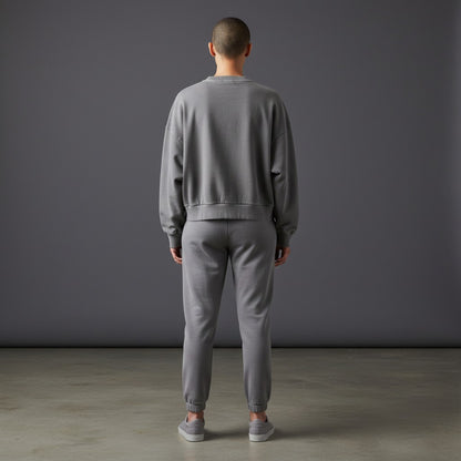 OMINA Studio vintage washed grey cropped sweatshirt with drop shoulders and ribbed cuffs and hem.