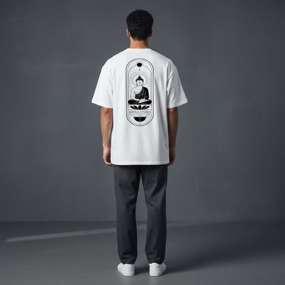 Model wearing an Omina heavyweight white cotton t-shirt with a black Buddha graphic on the back, relaxed fit.