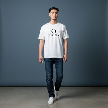 A man wearing an Omina white cotton crew neck t-shirt with a black Omina Studio logo graphic on the chest.