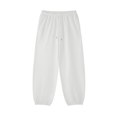 Omina white cotton blend jogged sweatpants with an elastic drawstring waist and cuffed ankles for a casual fit.