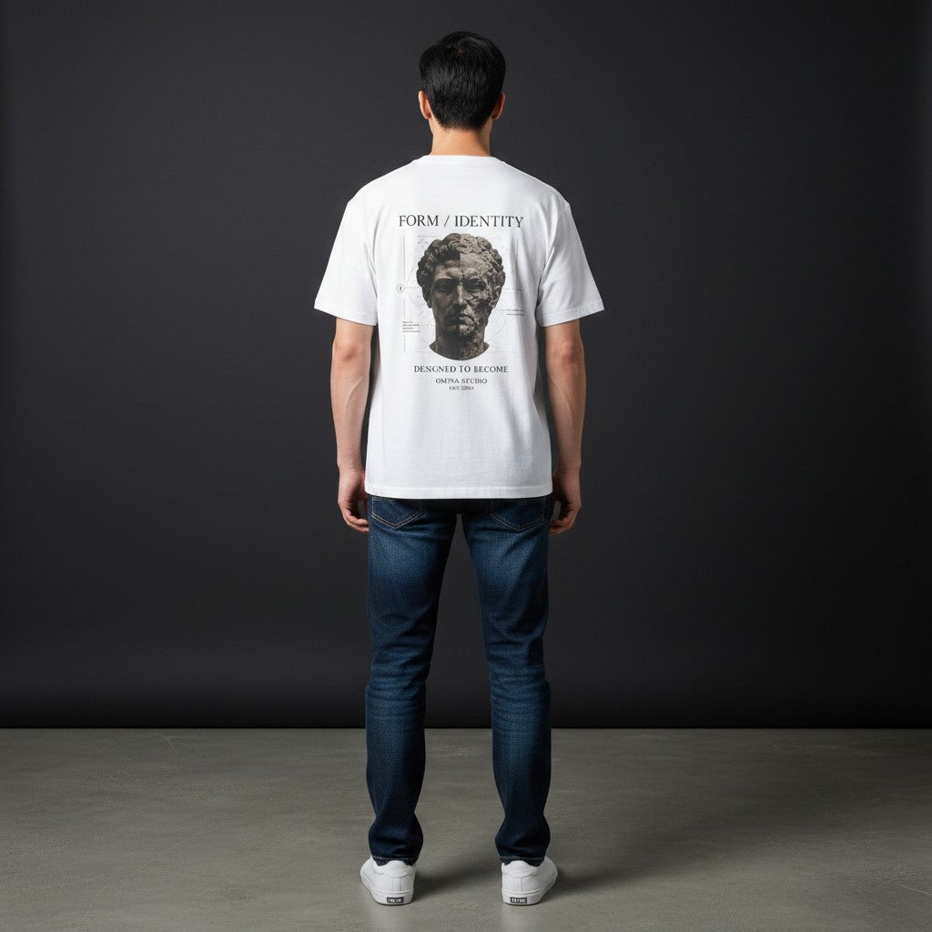 Man wearing Omina white cotton t-shirt with Form Identity graphic print on back, paired with blue jeans.