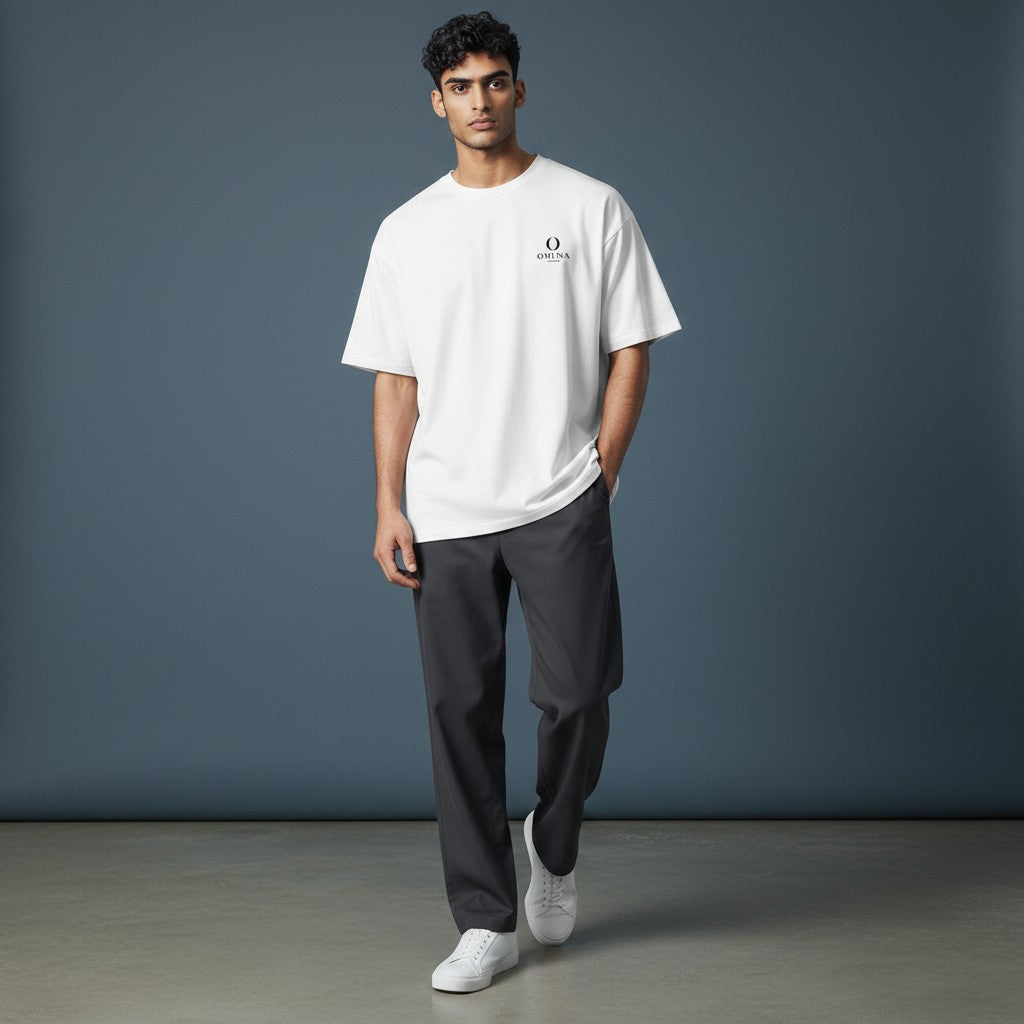 Model wearing an Omina white heavyweight cotton t-shirt with a relaxed fit and small chest logo
