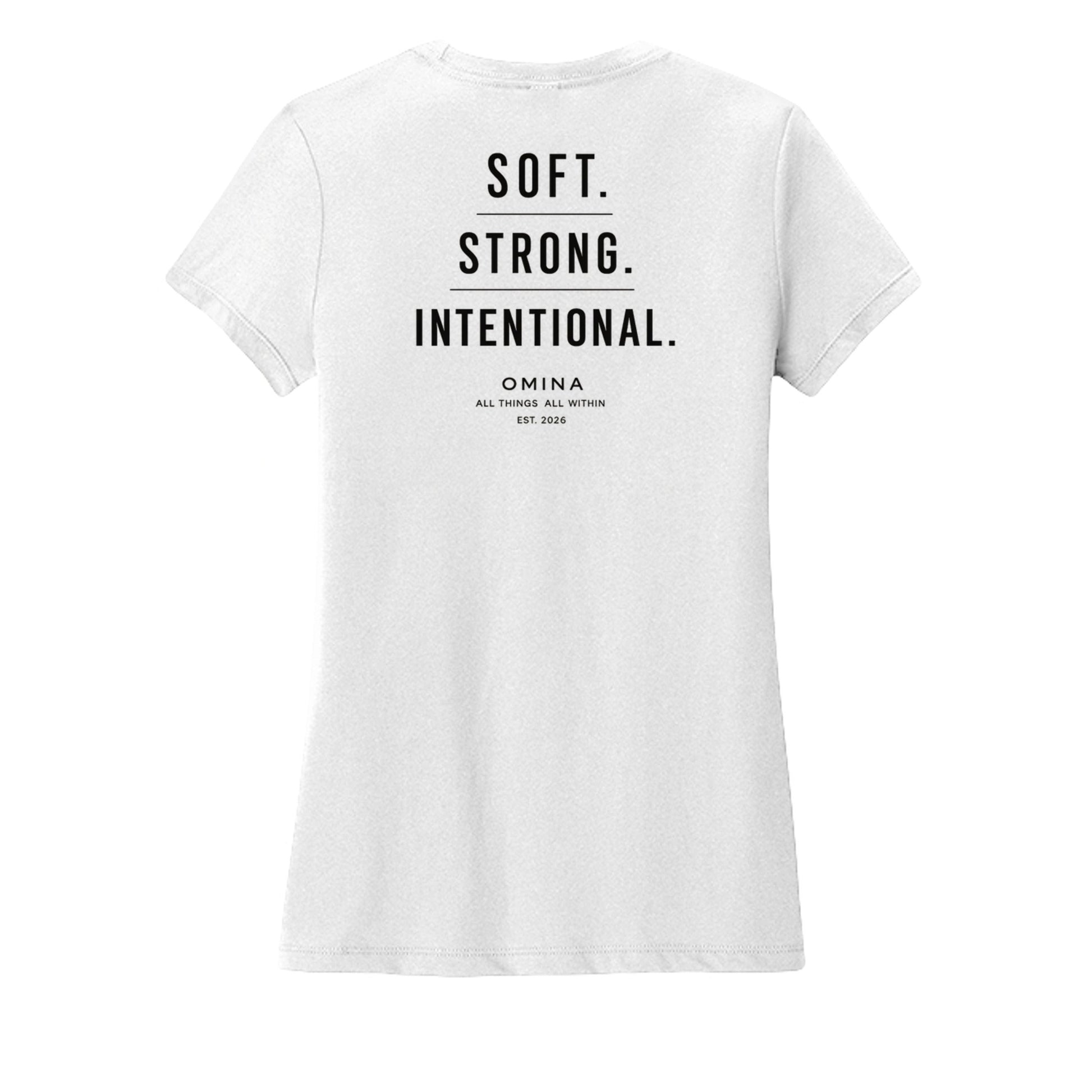 Omina white cotton t-shirt with black text reading SOFT. STRONG. INTENTIONAL. OMINA ALL THINGS ALL WITHIN EST. 2026.